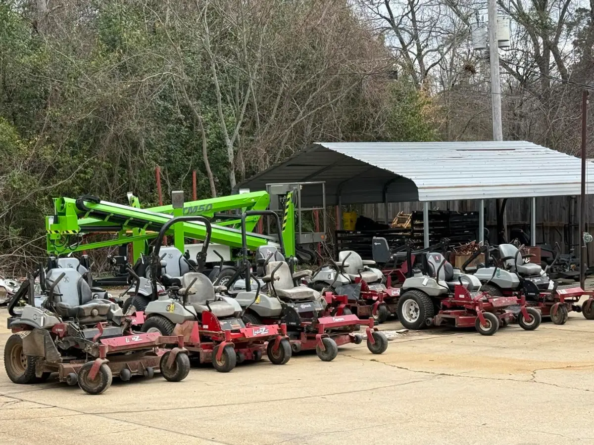 Rows of used mowers and equipment on the Brookhaven Rent-All lot