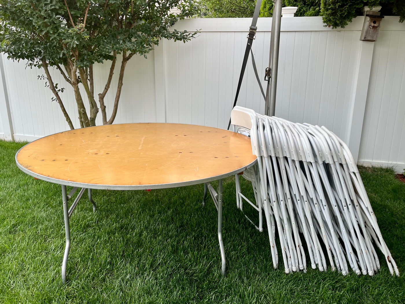 Round banquet table and folding chairs ready for pickup